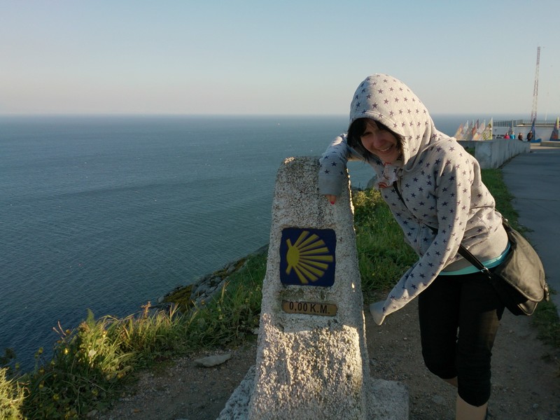 Una at The end of the earth, Cape Finisterre, Walking Camino de Santiago, Spain